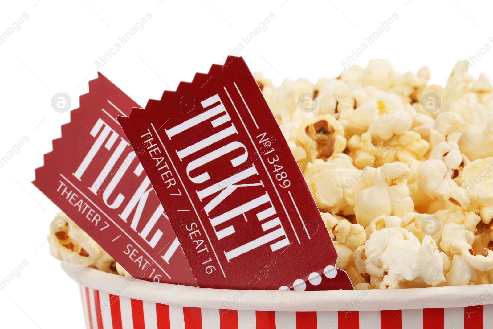 Photo of Tasty popcorn and movie tickets isolated on white