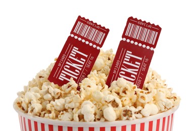 Photo of Tasty popcorn and movie tickets isolated on white