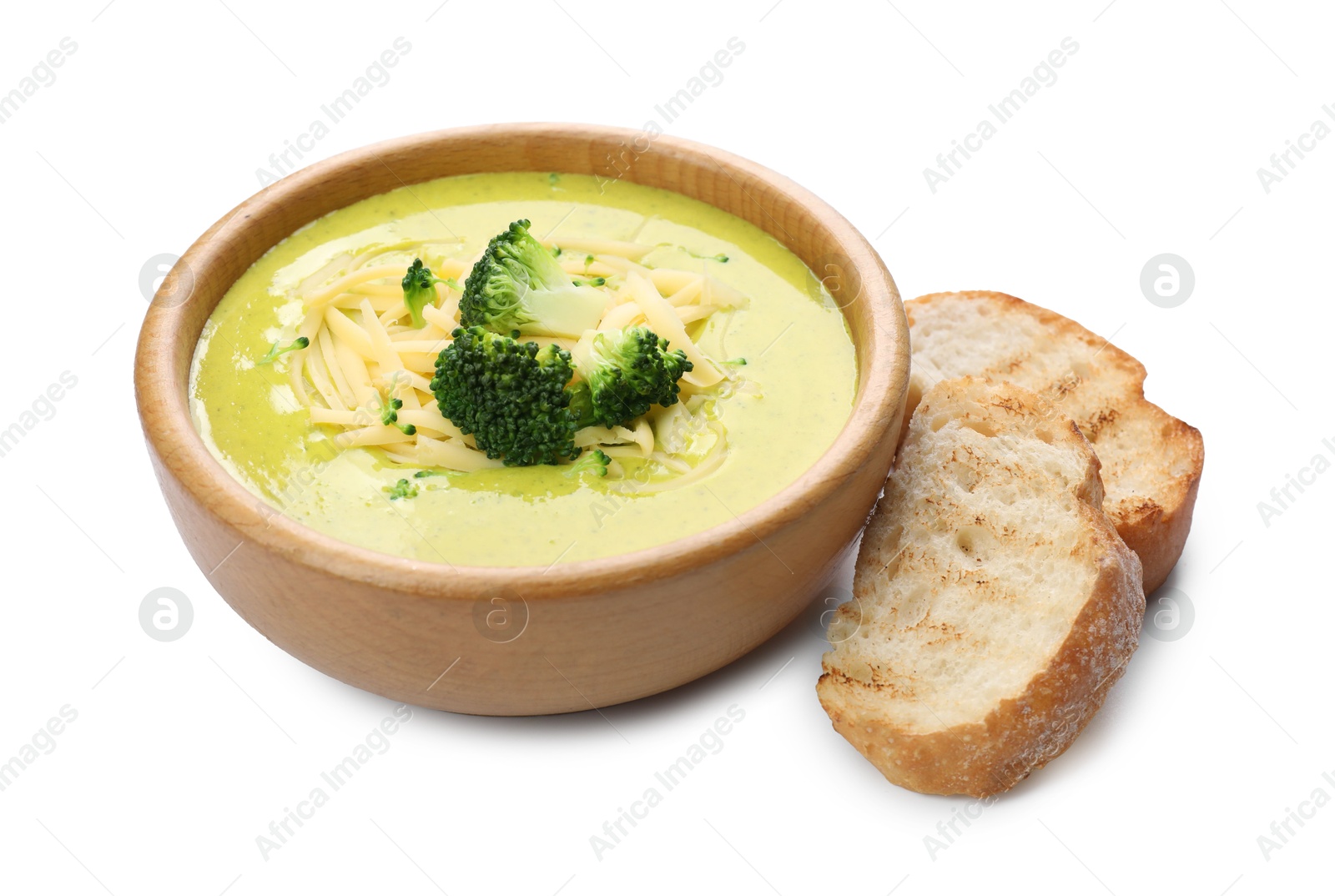 Photo of Delicious broccoli cream soup in bowl and croutons isolated on white