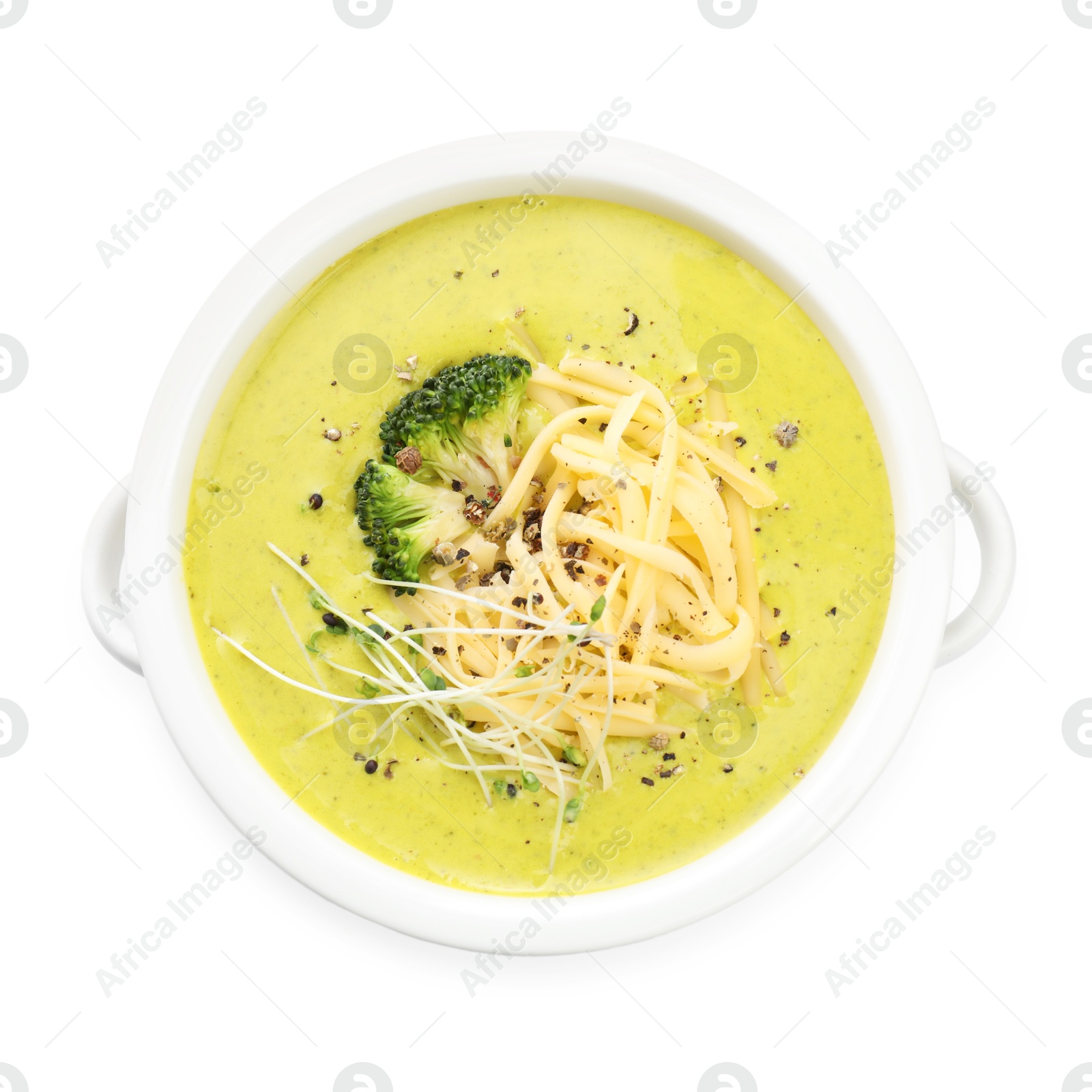 Photo of Delicious broccoli cream soup in bowl isolated on white, top view