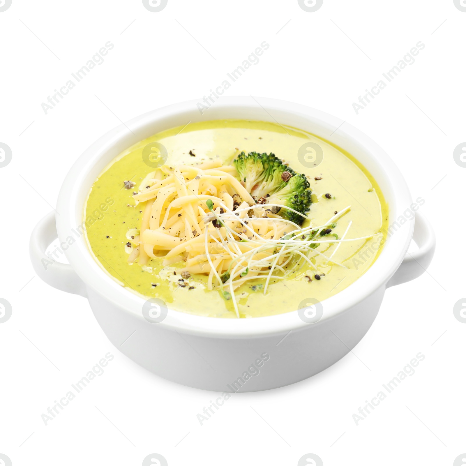 Photo of Delicious broccoli cream soup in bowl isolated on white