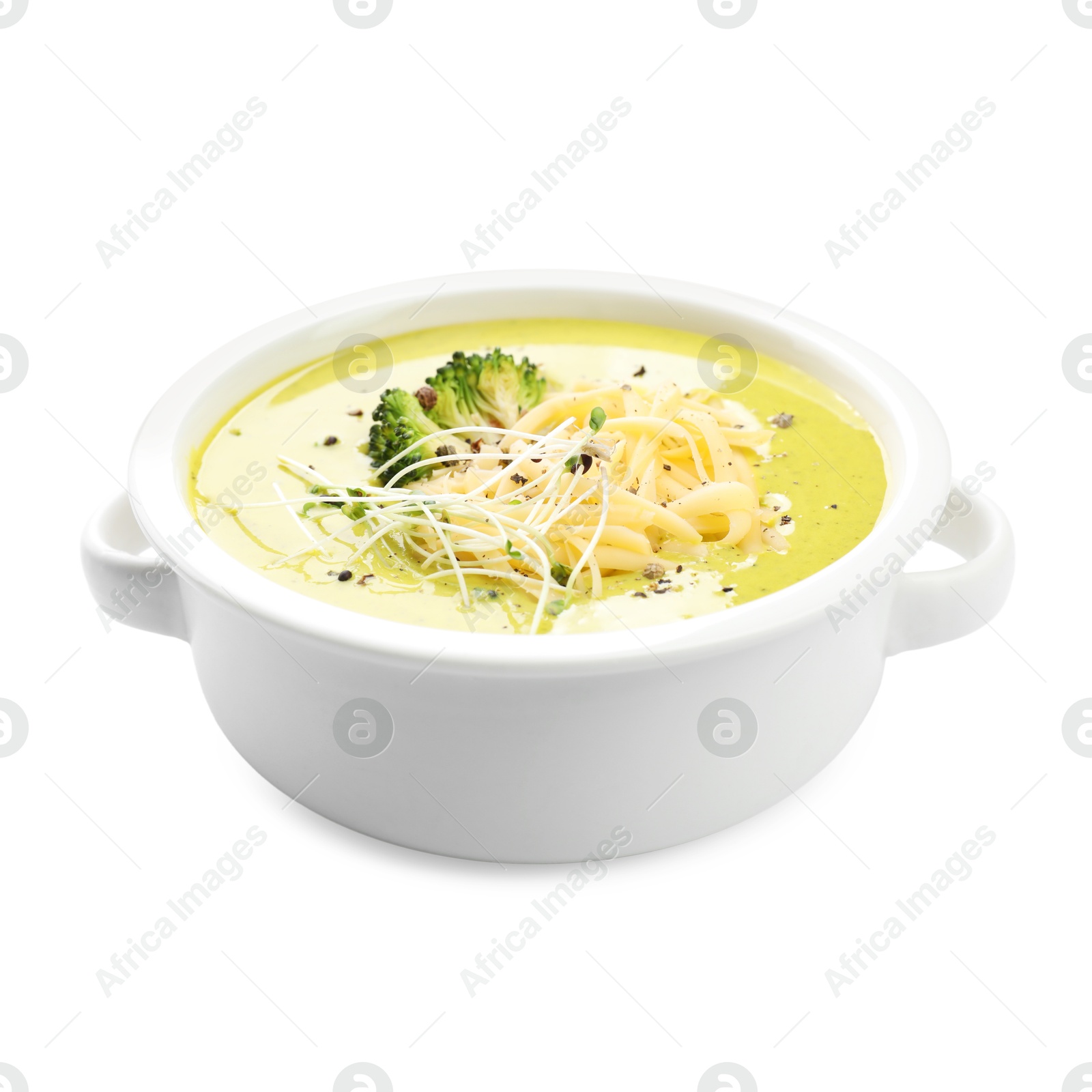 Photo of Delicious broccoli cream soup in bowl isolated on white