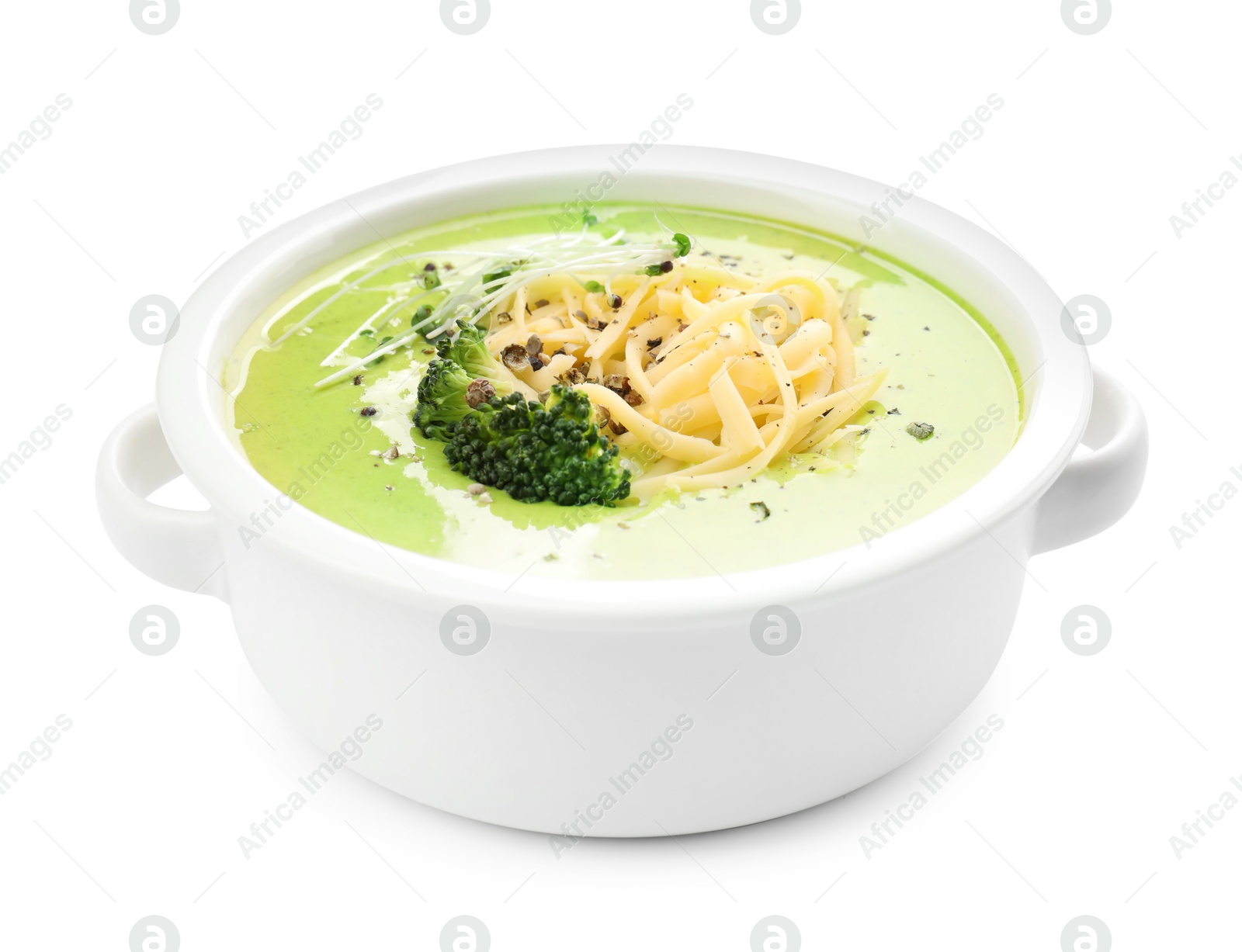 Photo of Delicious broccoli cream soup in bowl isolated on white