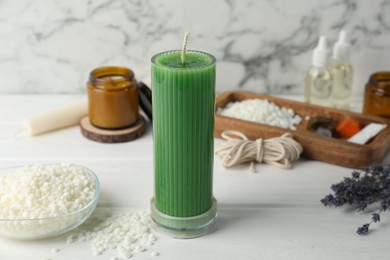 Photo of Soy wax candle on white wooden table