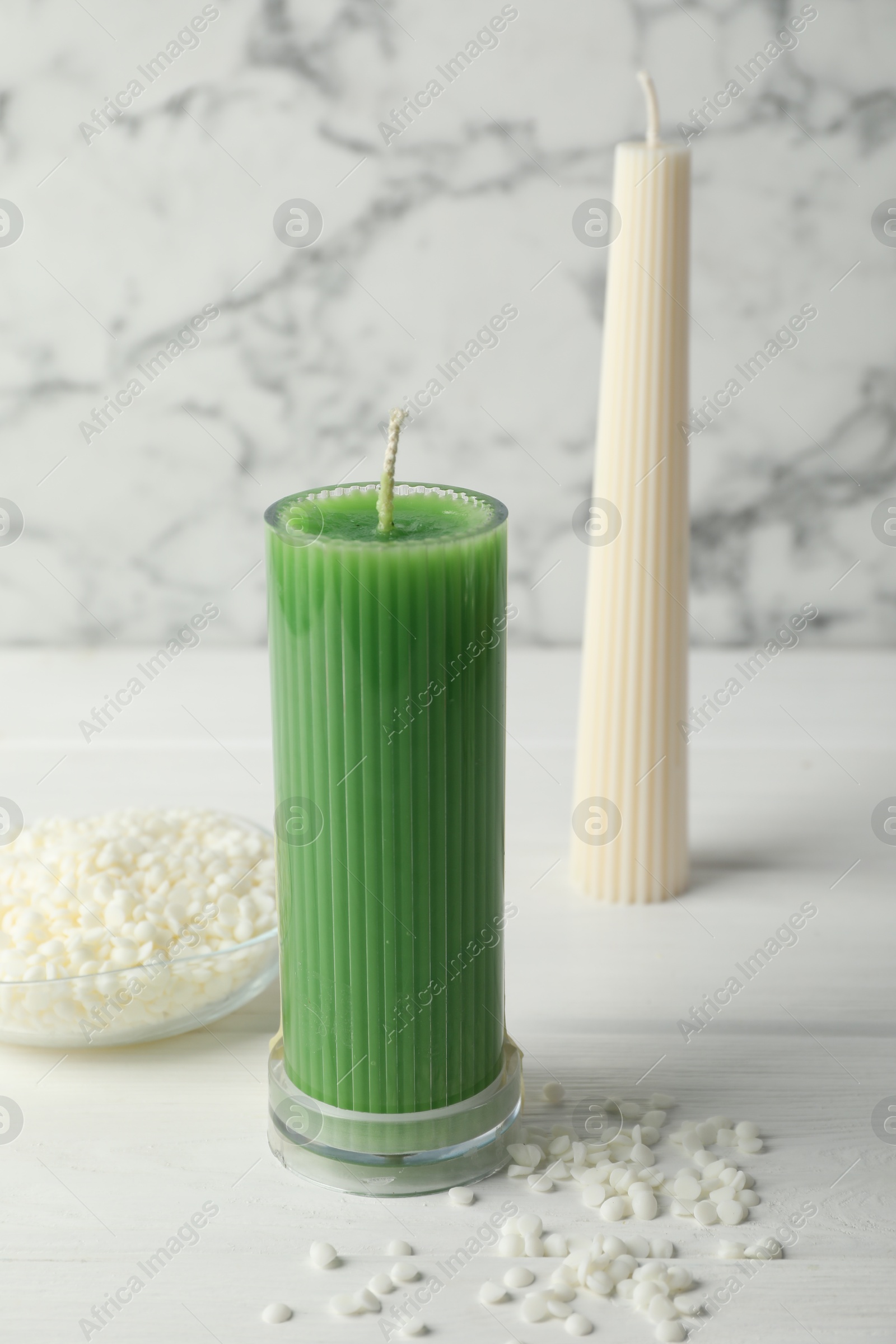 Photo of Soy wax candles on white wooden table