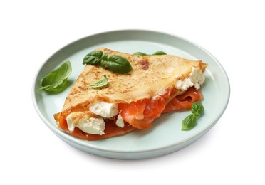 Photo of Delicious crepe with salmon, cream cheese and basil isolated on white