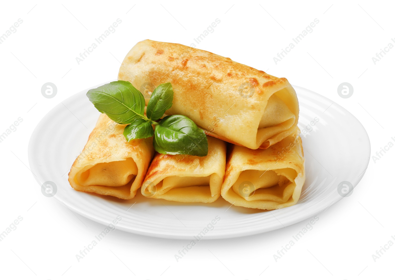 Photo of Delicious rolled crepes with basil isolated on white