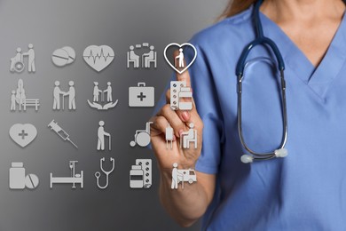 Image of Doctor using virtual screen with healthcare icons on grey background, closeup