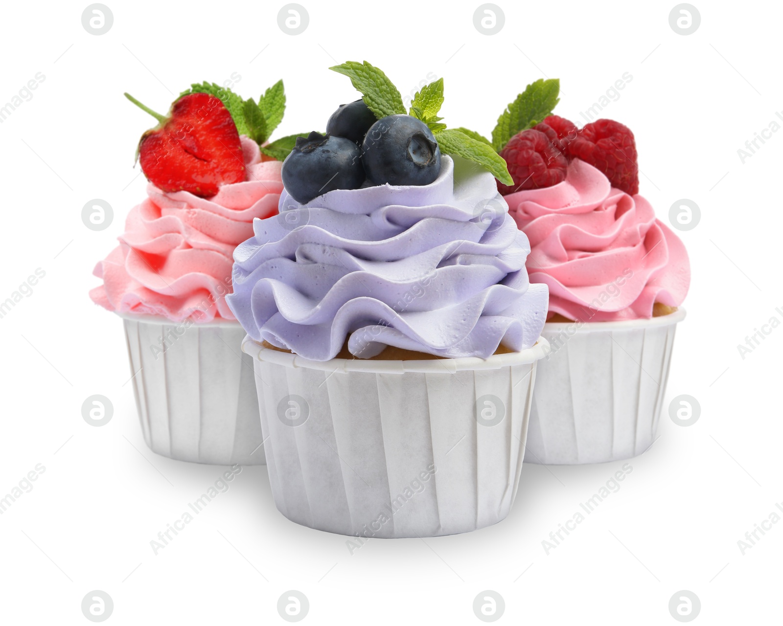 Image of Delicious cupcakes with berries isolated on white