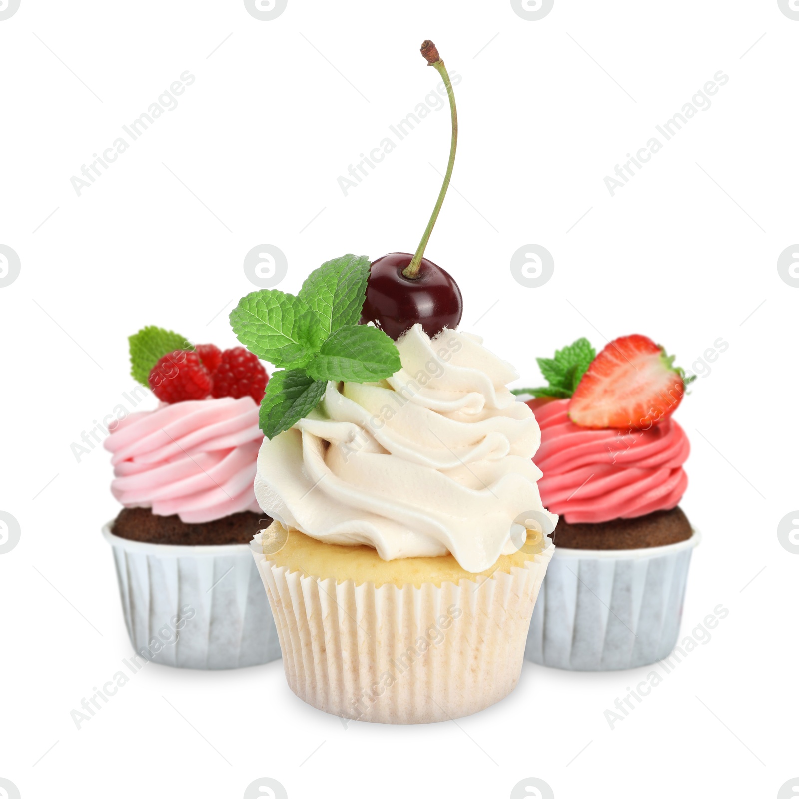 Image of Delicious cupcakes with berries isolated on white