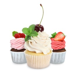 Image of Delicious cupcakes with berries isolated on white