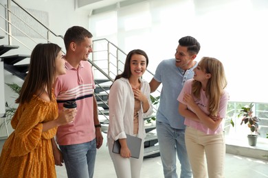 Photo of Group of people having conversation in hall