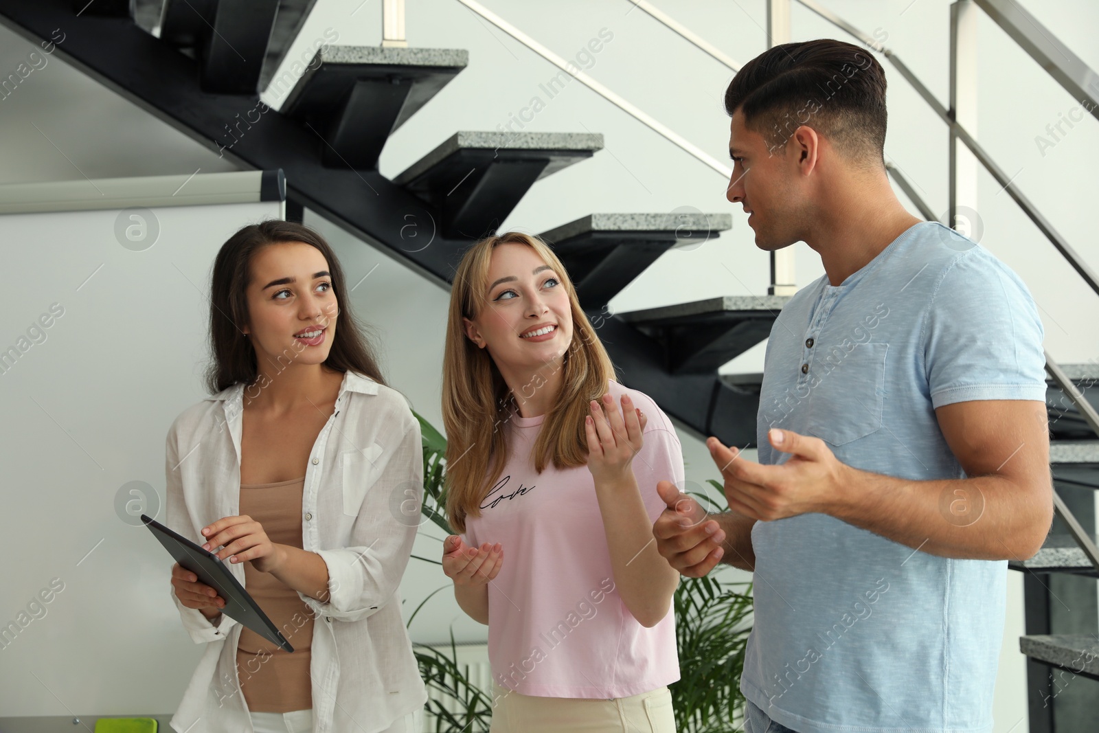 Photo of Group of people having conversation in hall