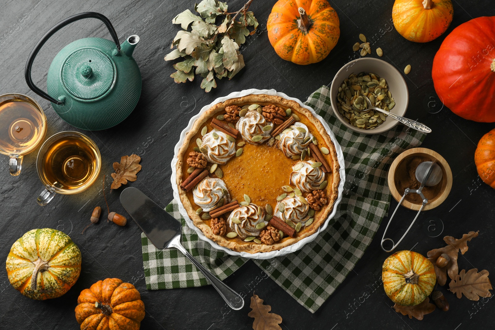 Photo of Flat lay composition with homemade pumpkin pie on black table