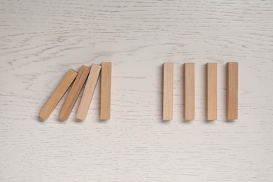 Many blocks on white wooden table, flat lay