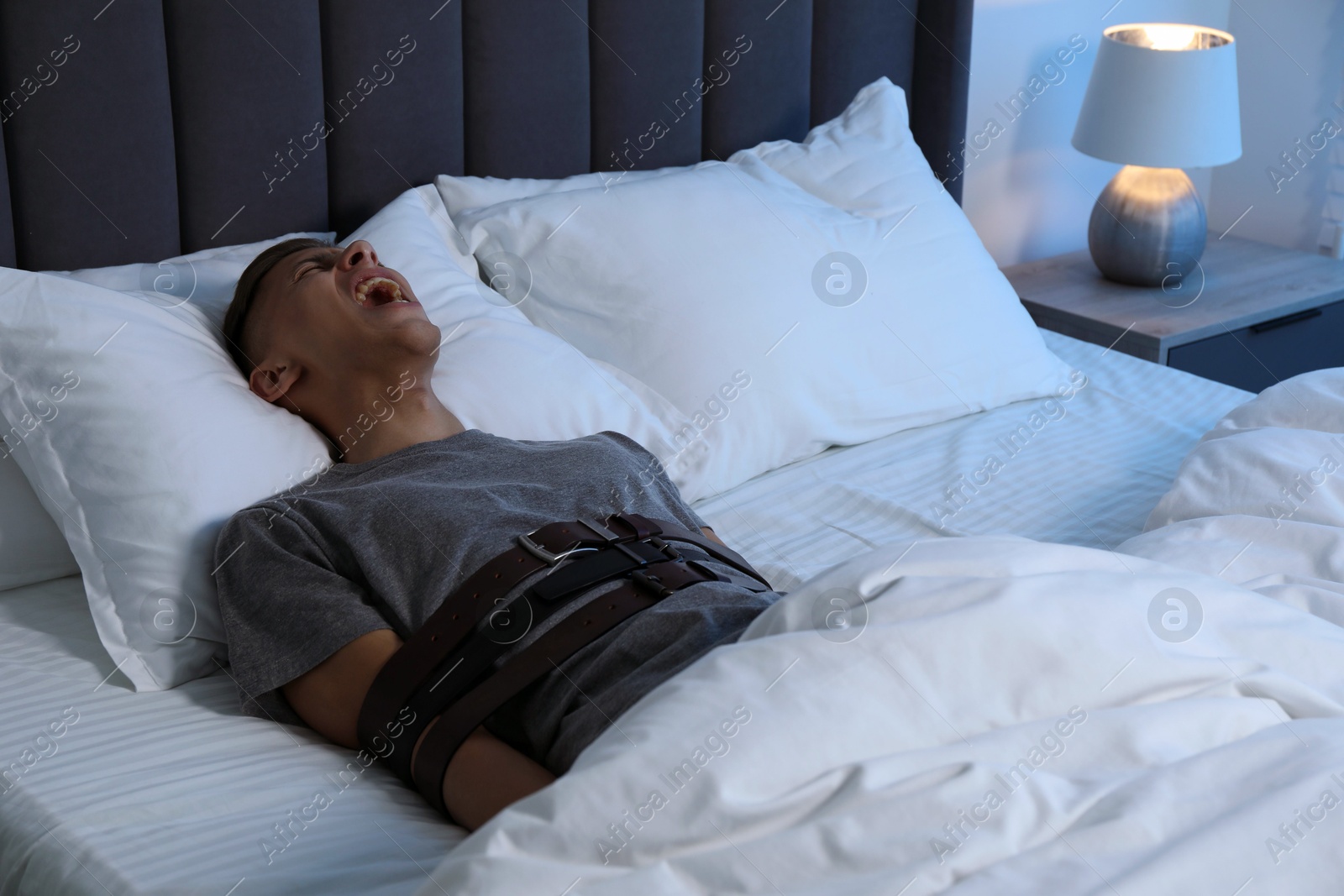 Photo of Man in sleepwalking condition screaming in bed