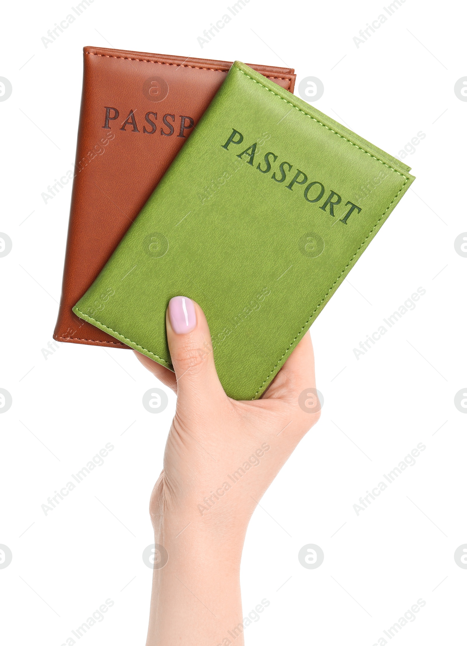 Photo of Woman holding passports in color covers on white background, closeup