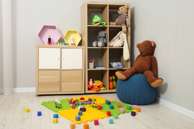 Photo of Beautiful kid's room interior with toys and stylish furniture