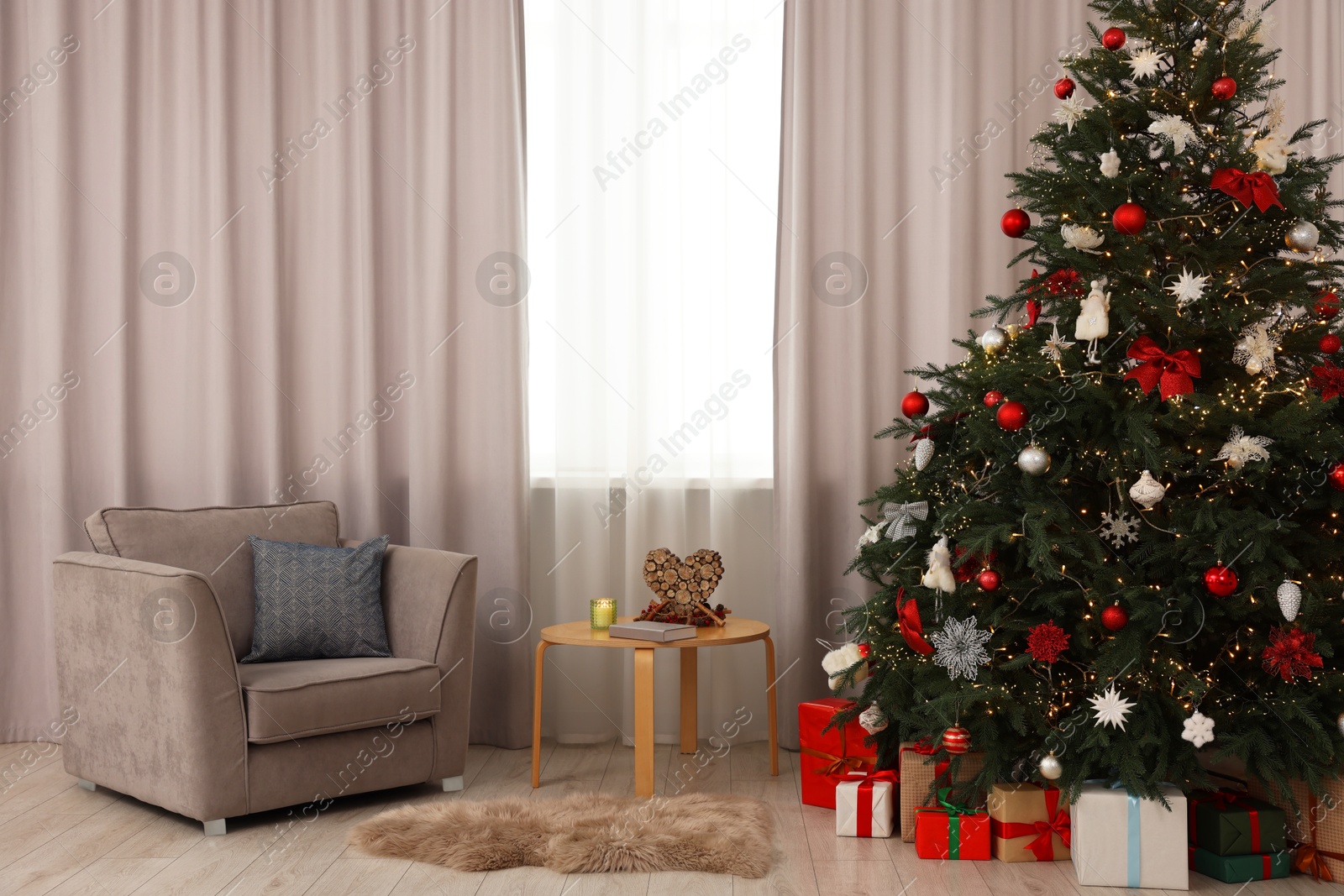 Photo of Beautifully decorated Christmas tree in room. Festive interior design