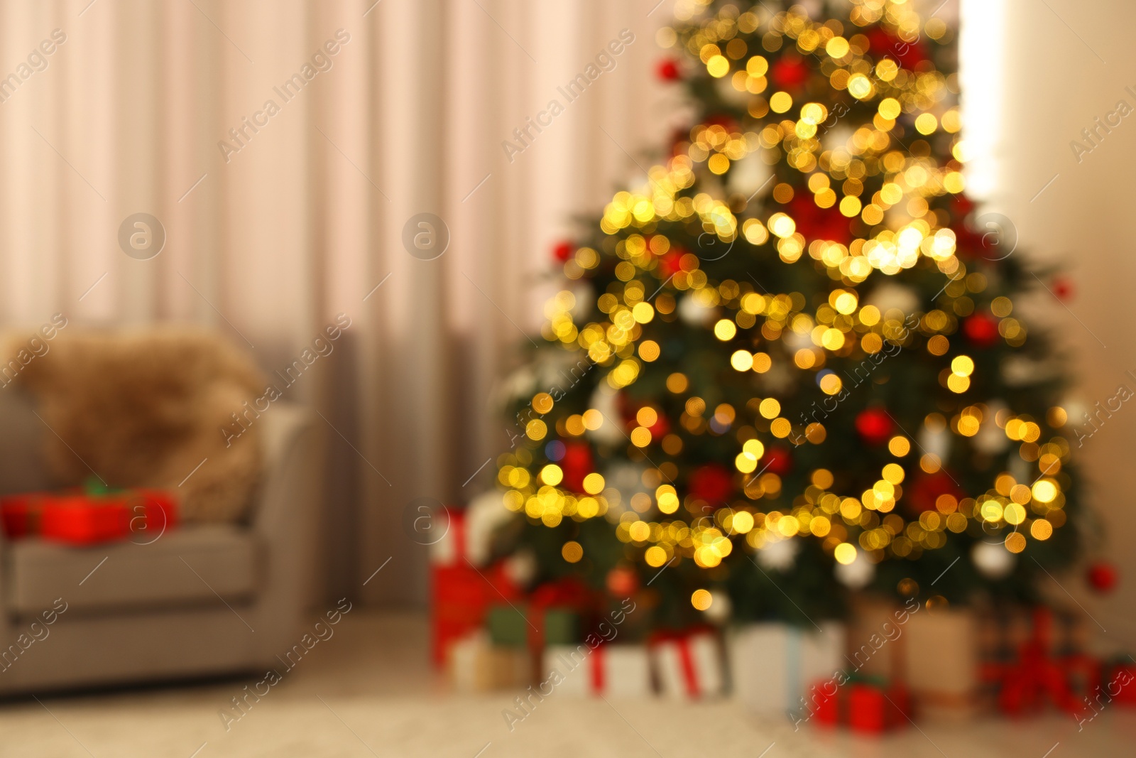 Photo of Blurred view of beautifully decorated Christmas tree in room. Festive interior design