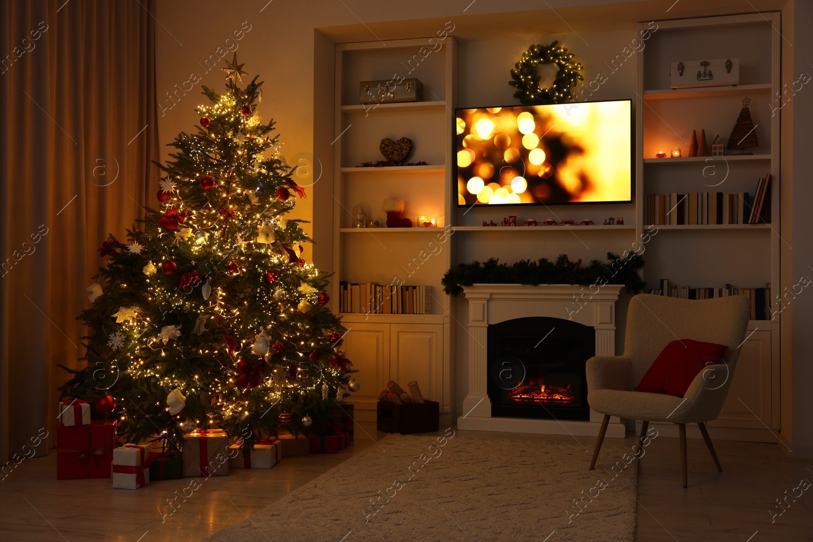 Photo of Beautifully decorated Christmas tree near fireplace in room. Festive interior design