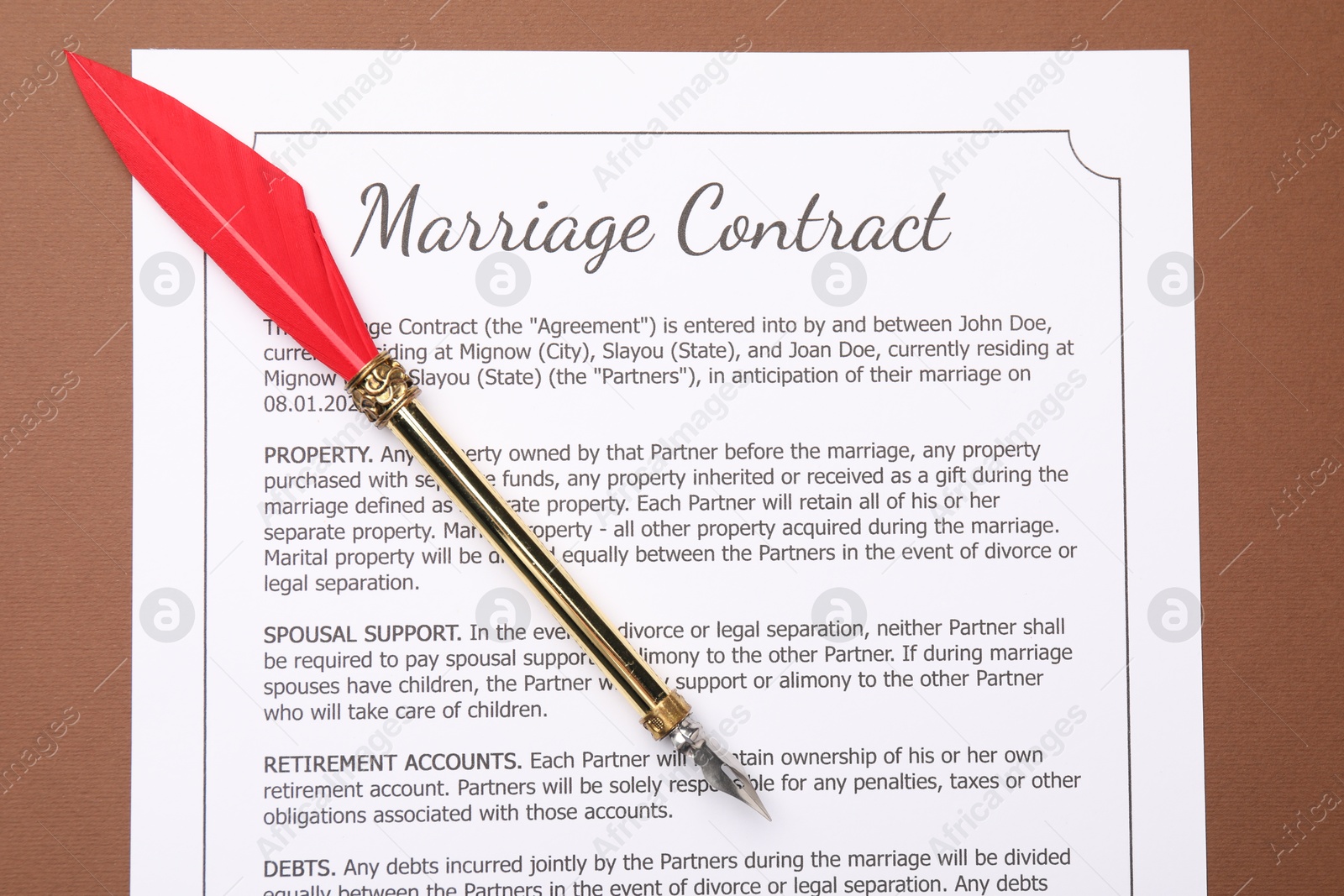 Photo of Marriage contract and fountain pen on brown background, top view