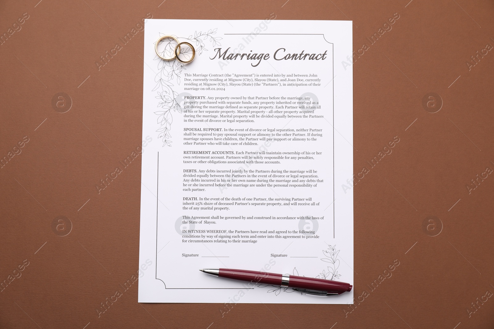 Photo of Marriage contract, pen and golden rings on brown background, top view