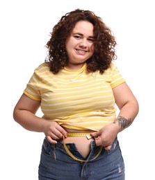 Photo of Weight loss. Happy plus size woman measuring waist with tape on white background