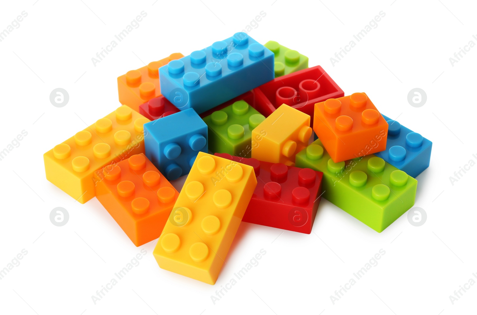 Photo of Construction toy. Pile of building bricks isolated on white