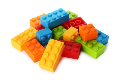 Photo of Construction toy. Pile of building bricks isolated on white