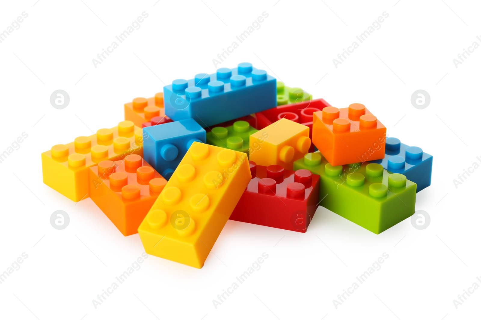 Photo of Construction toy. Pile of building bricks isolated on white