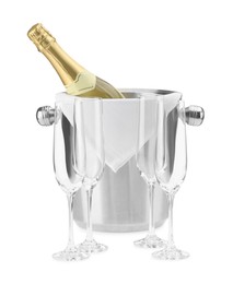 Photo of Bottle of champagne in ice bucket and empty glasses isolated on white