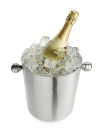 Photo of Bottle of champagne in ice bucket isolated on white