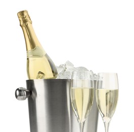 Photo of Champagne in glasses and ice bucket with bottle isolated on white