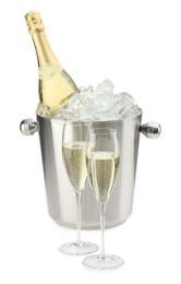 Photo of Champagne in glasses and ice bucket with bottle isolated on white