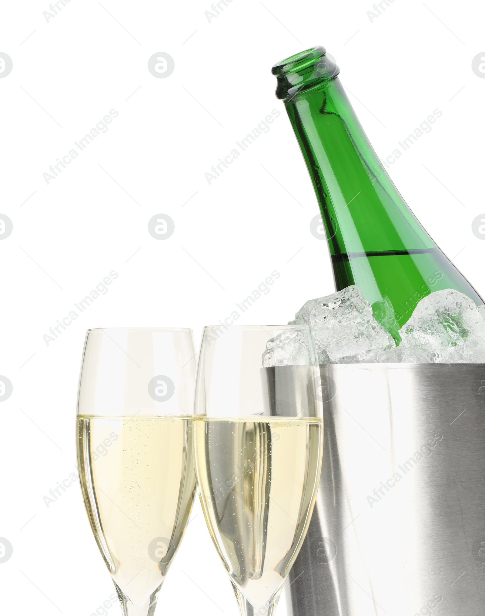 Photo of Champagne in glasses and ice bucket with open bottle isolated on white