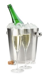 Photo of Champagne in glasses and ice bucket with open bottle isolated on white