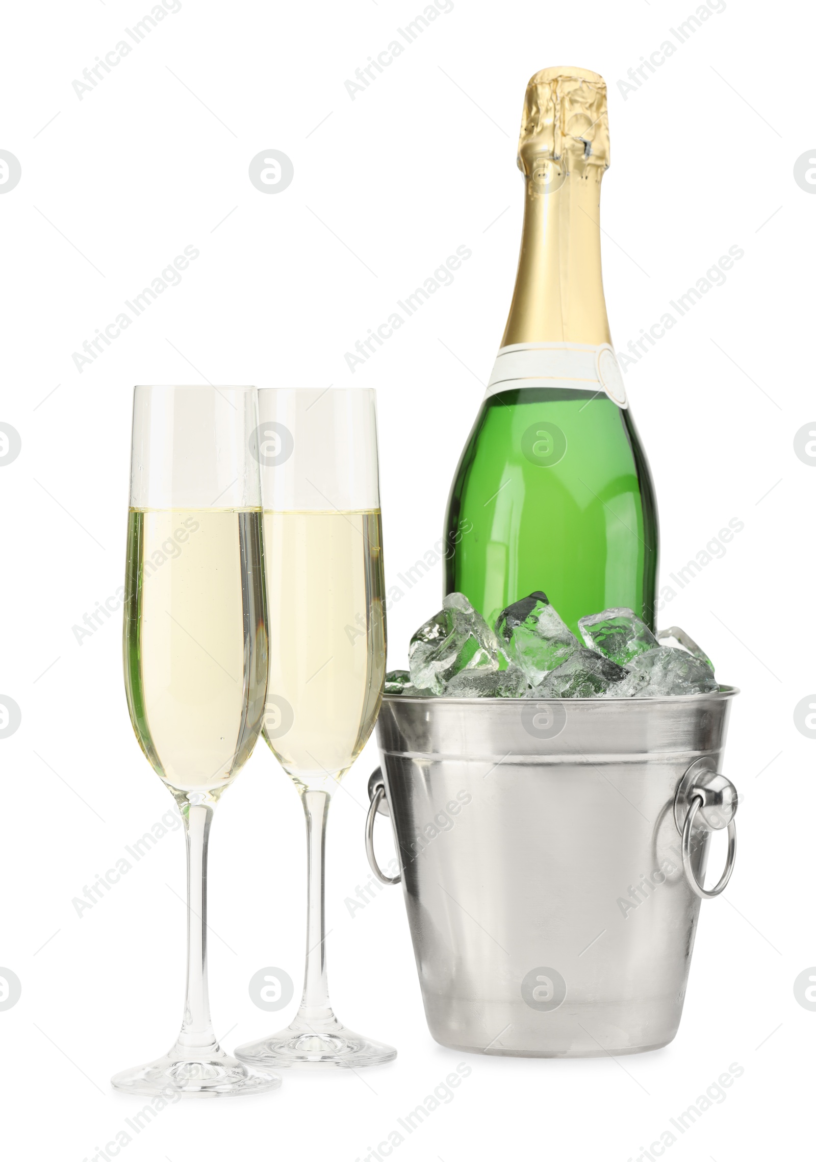 Photo of Champagne in glasses and ice bucket with bottle isolated on white