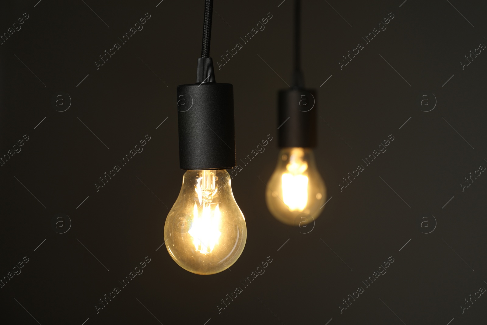 Photo of Light bulbs against grey background, selective focus. Space for text