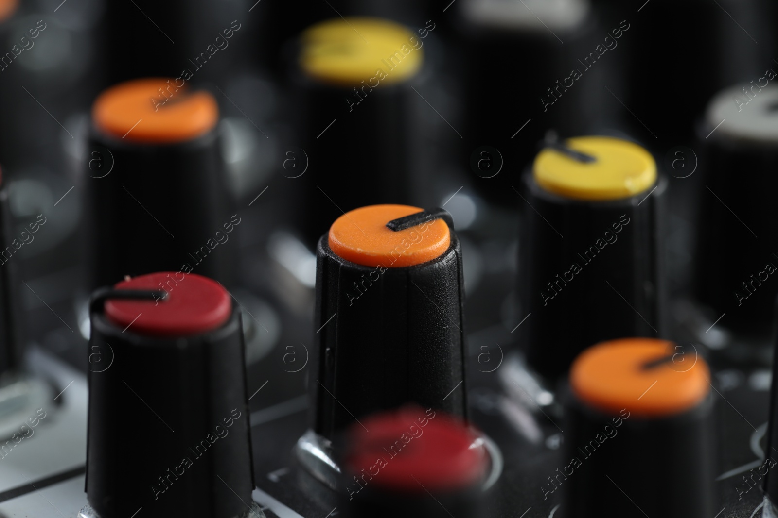 Photo of Professional mixing console, closeup. Radio studio equipment