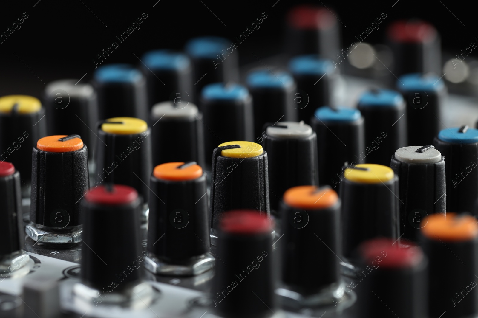 Photo of Professional mixing console, closeup. Radio studio equipment