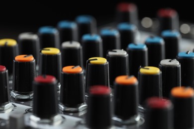 Photo of Professional mixing console, closeup. Radio studio equipment