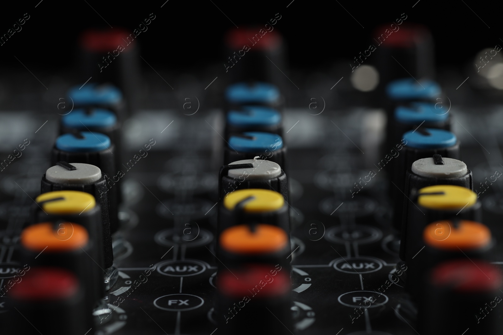 Photo of Professional mixing console, closeup. Radio studio equipment