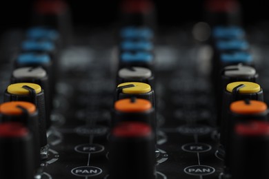 Photo of Professional mixing console, closeup. Radio studio equipment