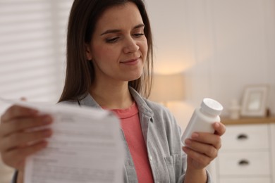 Woman with pills and medical instruction at home