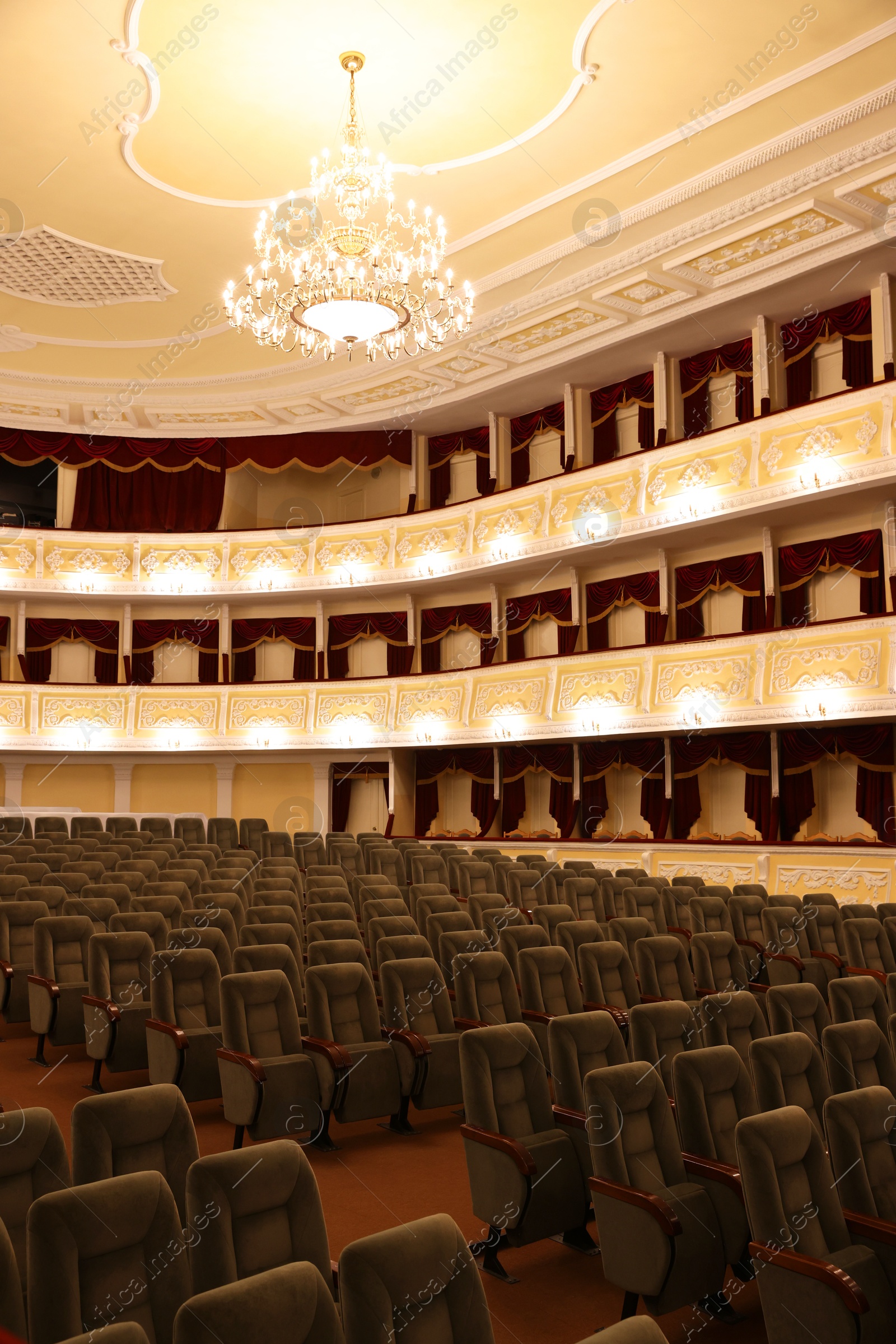 Photo of Rows of gray comfortable seats in theatre