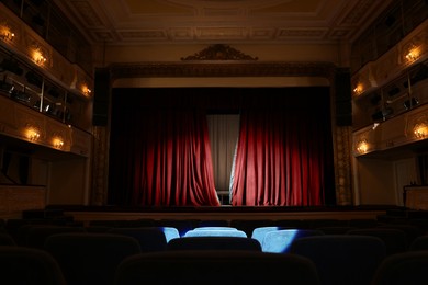 Photo of Theatre interior with stage and rows of comfortable seats