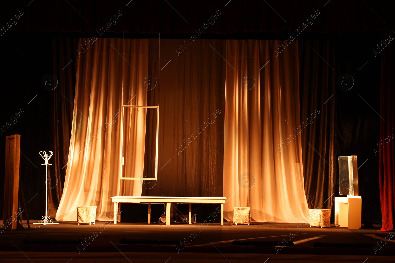 Photo of Different furniture and other decorations on stage in theatre