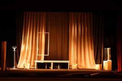 Photo of Different furniture and other decorations on stage in theatre