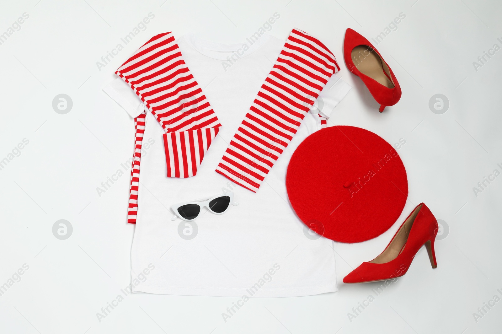 Photo of Retro styled outfit on white background, flat lay